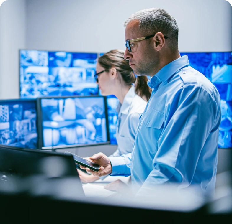 Control room staff reviewing video feeds