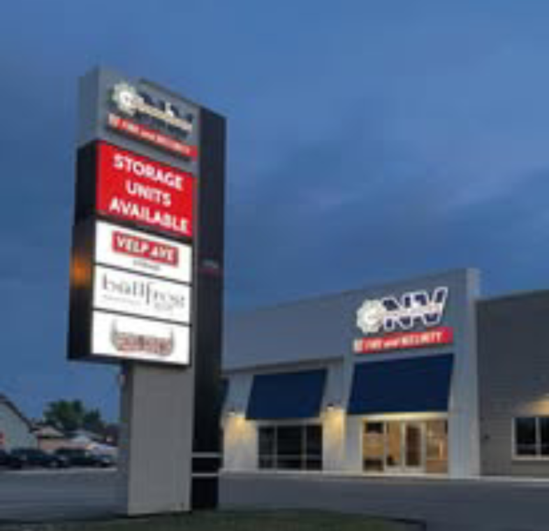 Self storage facility with illuminated sign
