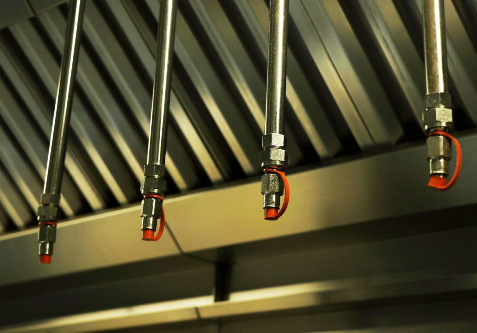 Commercial kitchen fire suppression nozzles